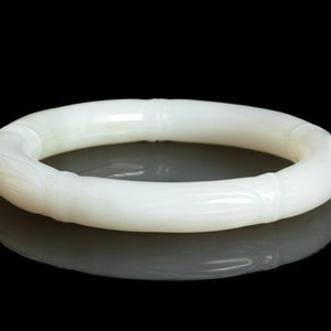 Appraisal: A Chinese White Jade 'Bamboo' Bangle the creamy pale stone