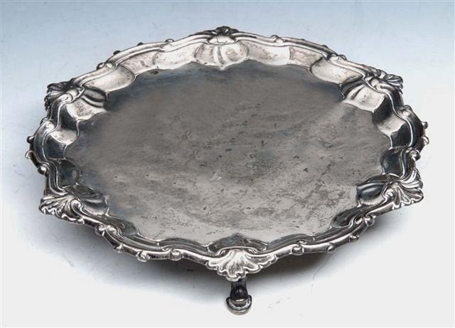 Appraisal: A GEORGE II SILVER WAITER with a scroll and shell