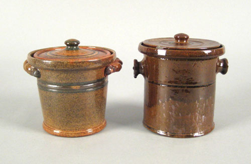 Appraisal: Two glazed redware lidded canisters by Isaac Stahl dated and