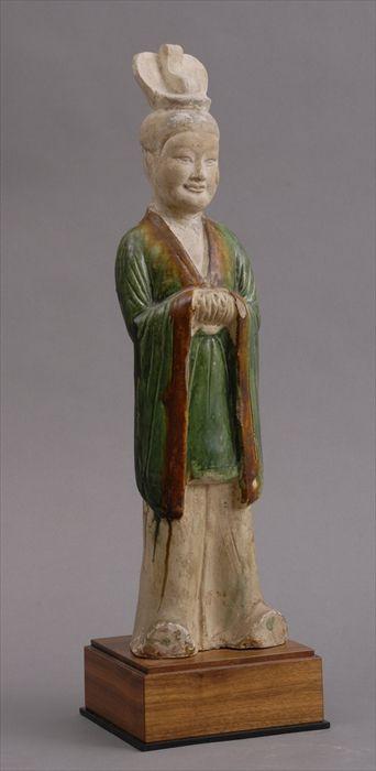 Appraisal: TANG GREEN GLAZED POTTERY FIGURE OF FEMALE ATTENDANT in