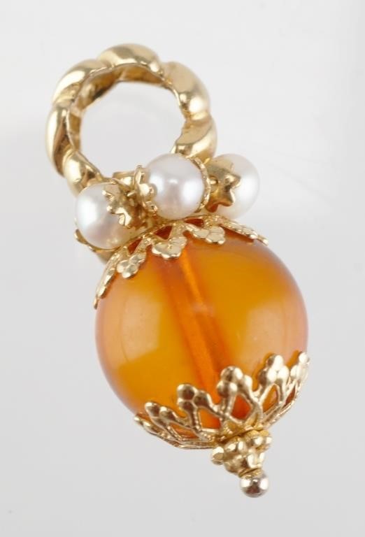 Appraisal: K yellow gold necklace pendant with pearls above an amber