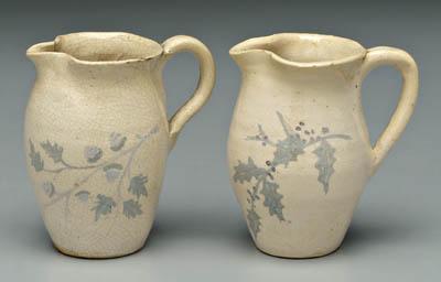 Appraisal: Two decorated cream pitchers one with oak leaf and acorn