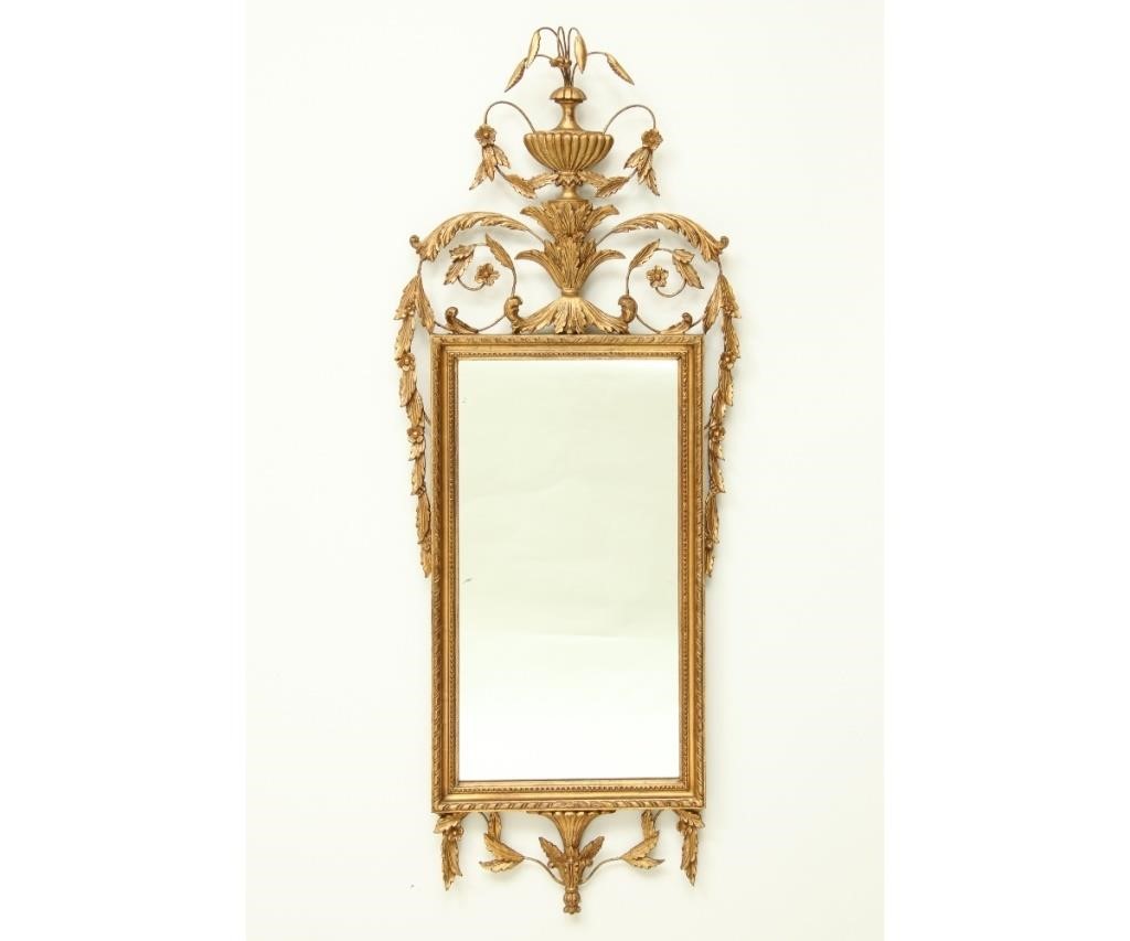 Appraisal: Carved Italian giltwood mirror with urn final with sprigs th