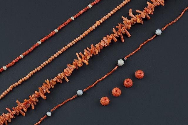 Appraisal: A collection of coral and costume jewellery comprising two coral