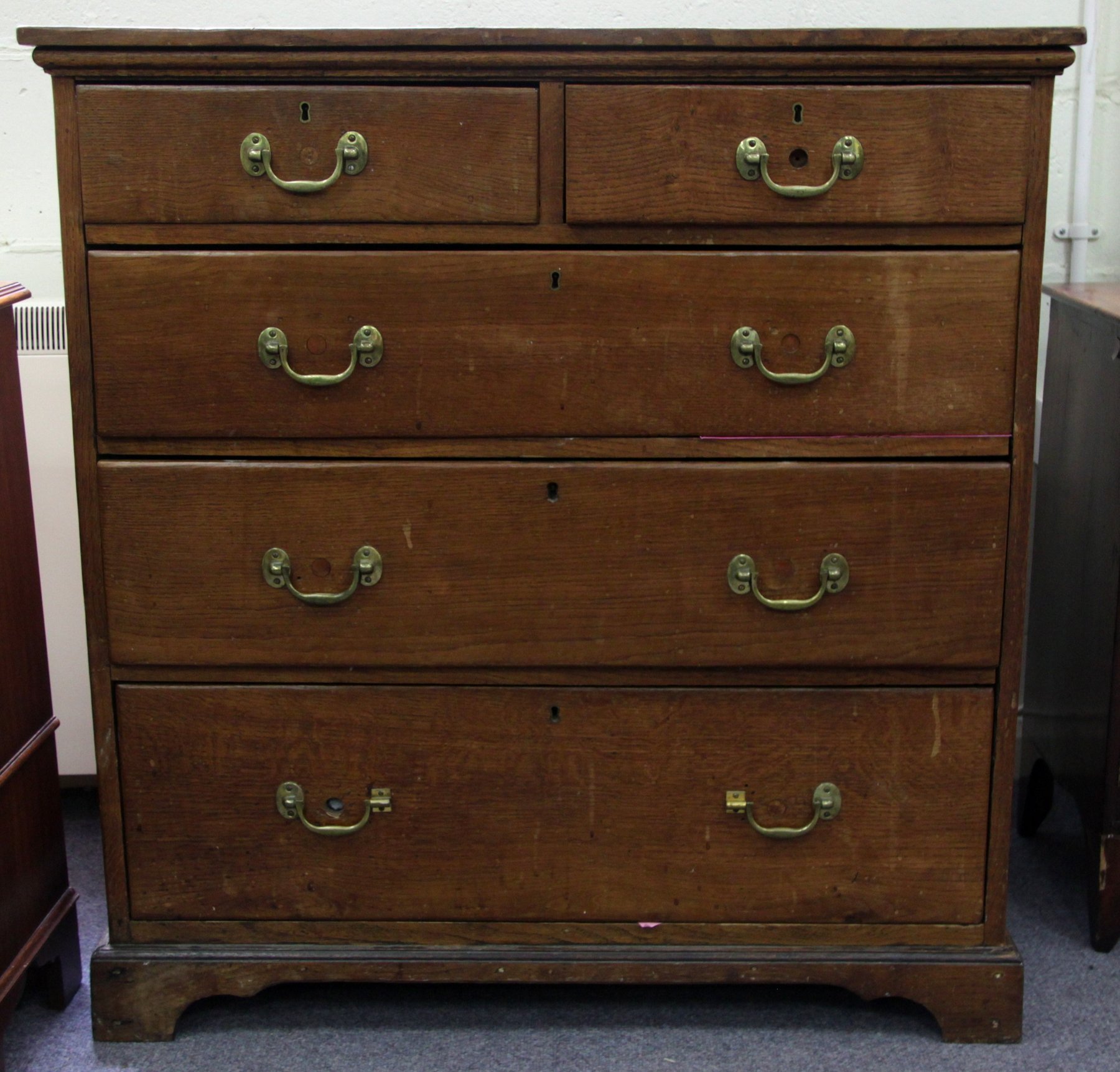 Appraisal: A th Century oak chest of two short over three