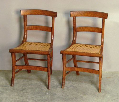 Appraisal: Pair of tiger maple saber leg chairs th c