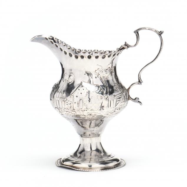 Appraisal: GEORGE III SILVER REPOUSSE SCENIC MILK JUG MARK OF HESTER