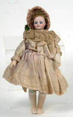 Appraisal: A German bisque swivel shoulder head girl doll with fixed