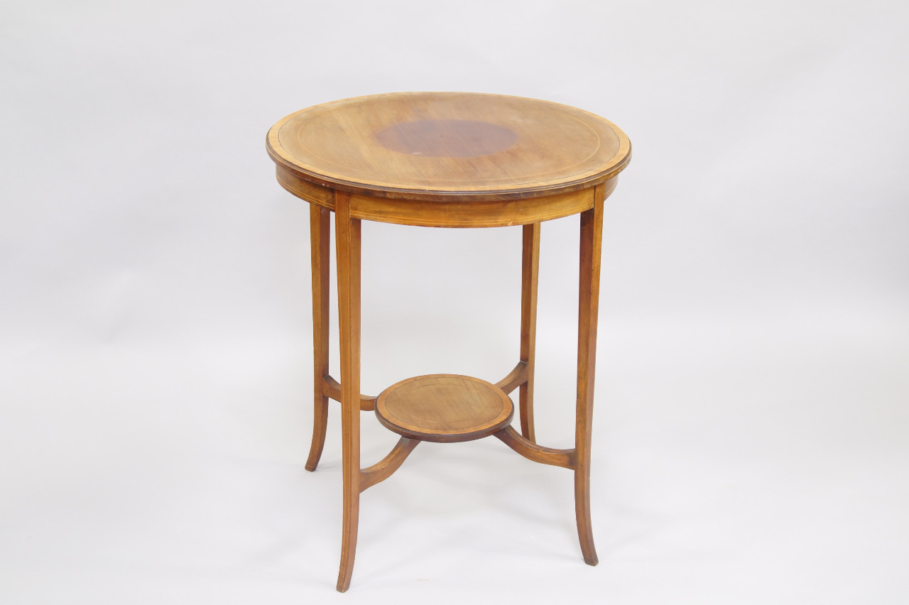 Appraisal: An Edwardian mahogany and boxwood line inlaid circular occasional table