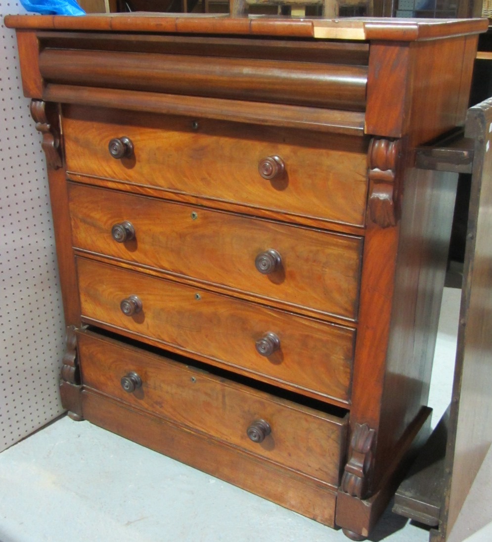 Appraisal: A th century flame mahogany chest of five long drawers