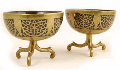 Appraisal: A pair of brass mounted and coconut bowls in cm