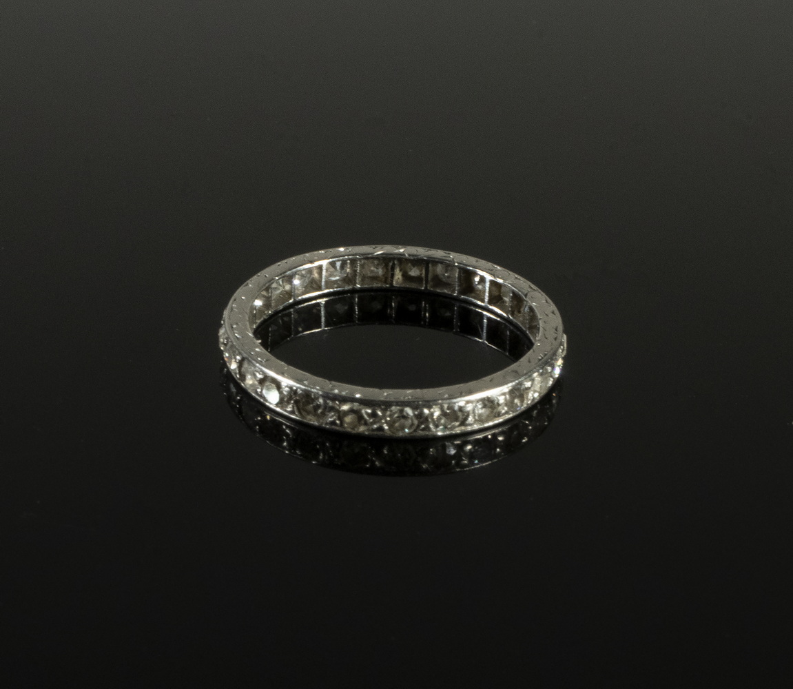 Appraisal: PLATINUM DIAMOND ETERNITY BAND Narrow band channel set with diamonds