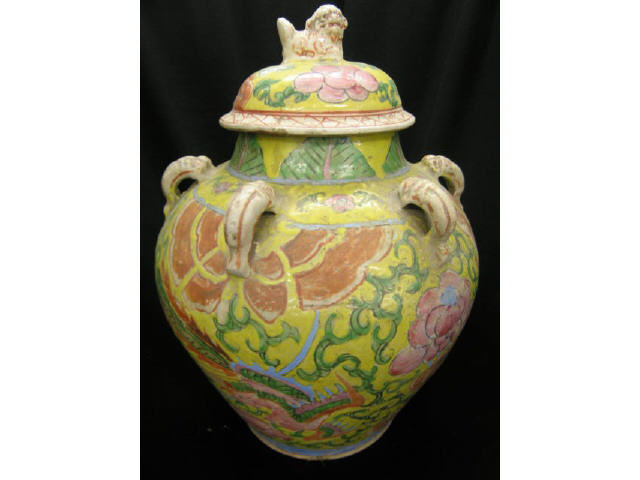 Appraisal: Oriental Porcelain Covered Storage Jar handled foo dog finial