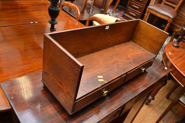 Appraisal: A LATE REGENCY OAK TWO DRAWER BOOK SHELF ON CASTORS