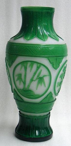 Appraisal: A green overlay decorated milk glass vase Of baluster form