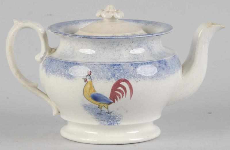 Appraisal: Spatterware Tea Pot Description Circa Blue with yellow blue and