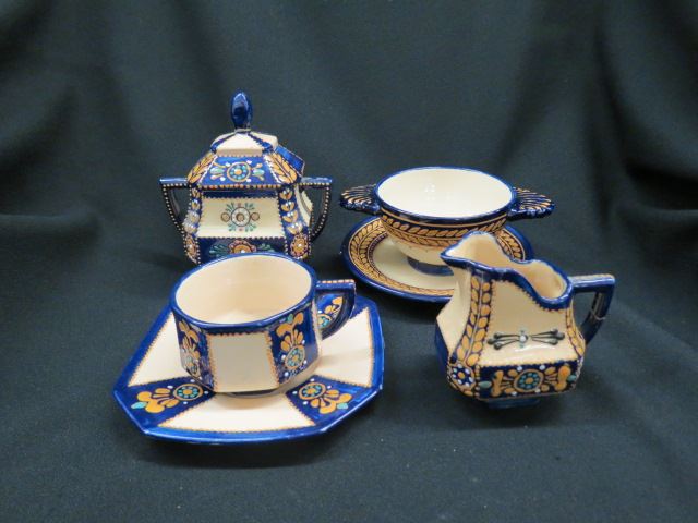 Appraisal: pcs Quimper French Pottery sugar creamer cups saucers porringer with