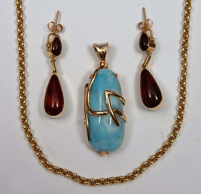 Appraisal: Blue hardstone pendantwith k gold attachement together with a k