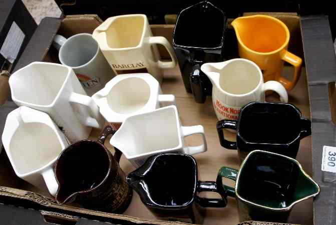 Appraisal: A collection of Wade Advertising Jugs including Titz Silk Cut