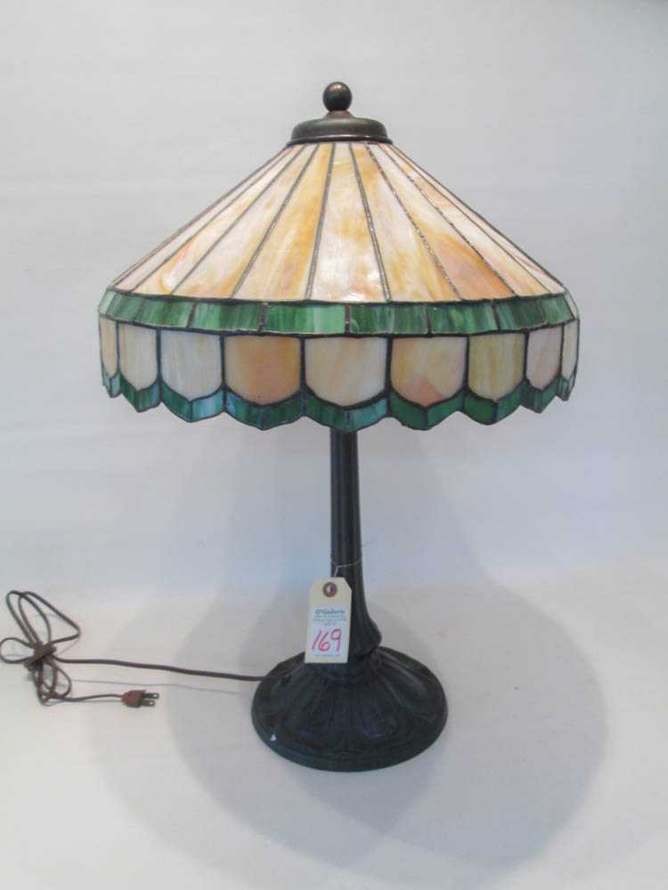 Appraisal: SLAG GLASS TABLE LAMP the shade having twenty-four caramel slag