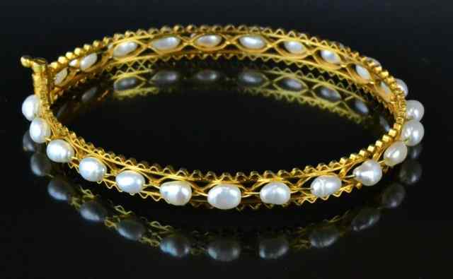 Appraisal: K Gold Sea Pearl Bangle BraceletA fine K filigree style