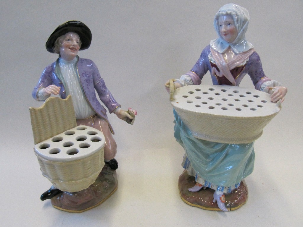 Appraisal: Two Meissen porcelain figural flower holders she carrying a basket