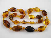 Appraisal: An amber necklace largest bead approx mm long necklace approx