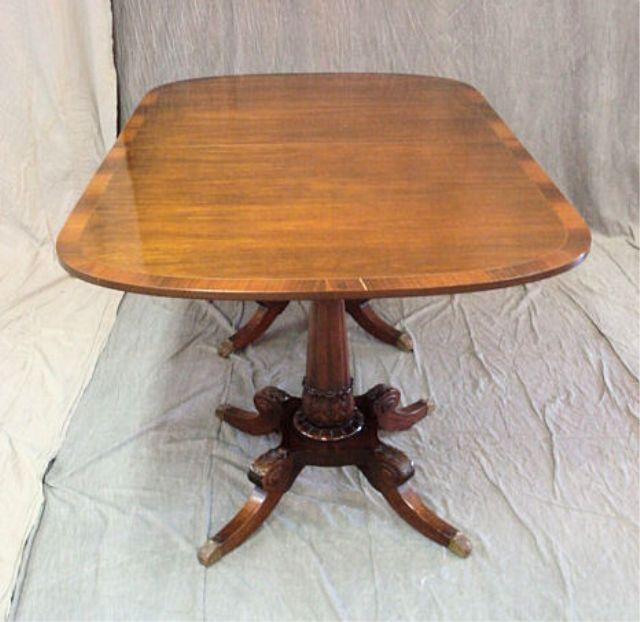 Appraisal: Mahogany Dining Table with Rosewood Banding With carved four leg