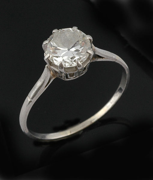 Appraisal: A diamond solitaire ring The old European cut diamond weighing