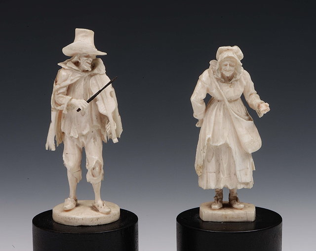 Appraisal: A pair of North European probably Dieppe ivory carved figures