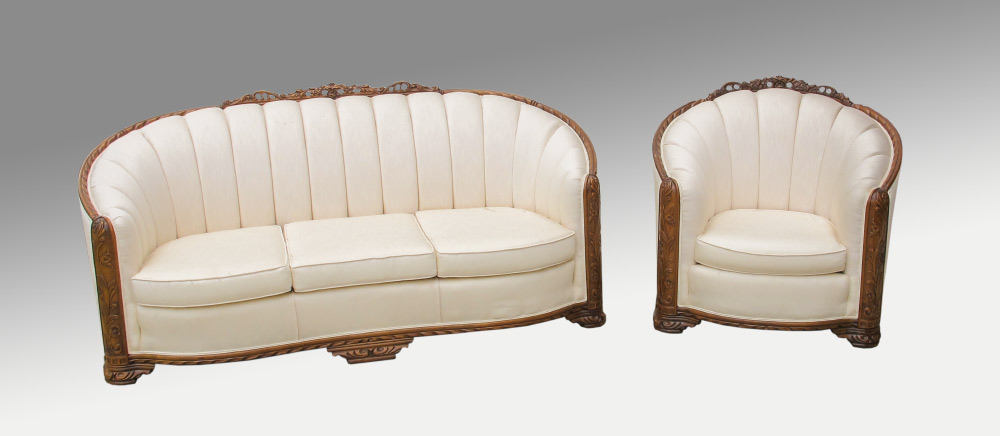 Appraisal: EUROPEAN CARVED WALNUT FLORAL SOFA AND CHAIR Matched pair with