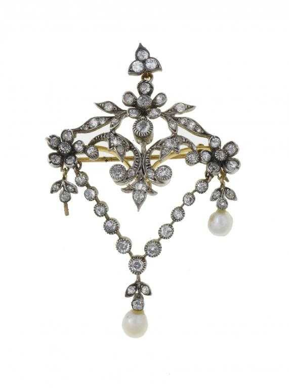 Appraisal: A DIAMOND AND CULTURED PEARL SWAG BROOCH-PENDANT fully articulated with