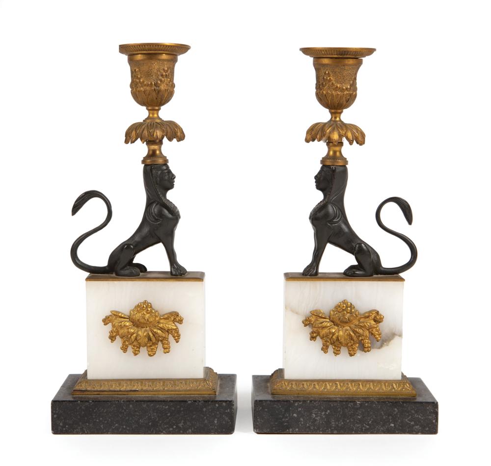 Appraisal: Pair of Empire Gilt and Patinated Bronze Sphinx Figural Candlesticks