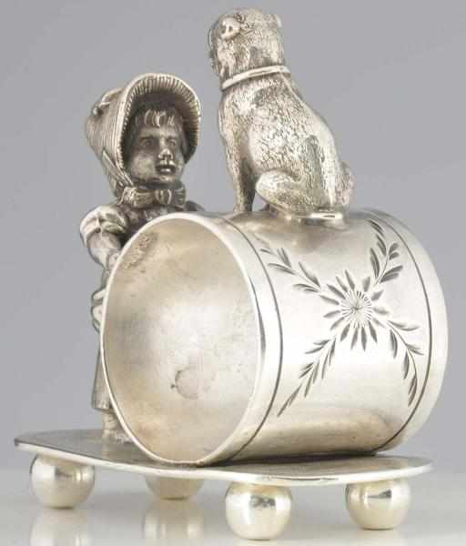 Appraisal: Kate Greenaway Girl with Pug Figural Napkin Ring Girl looks