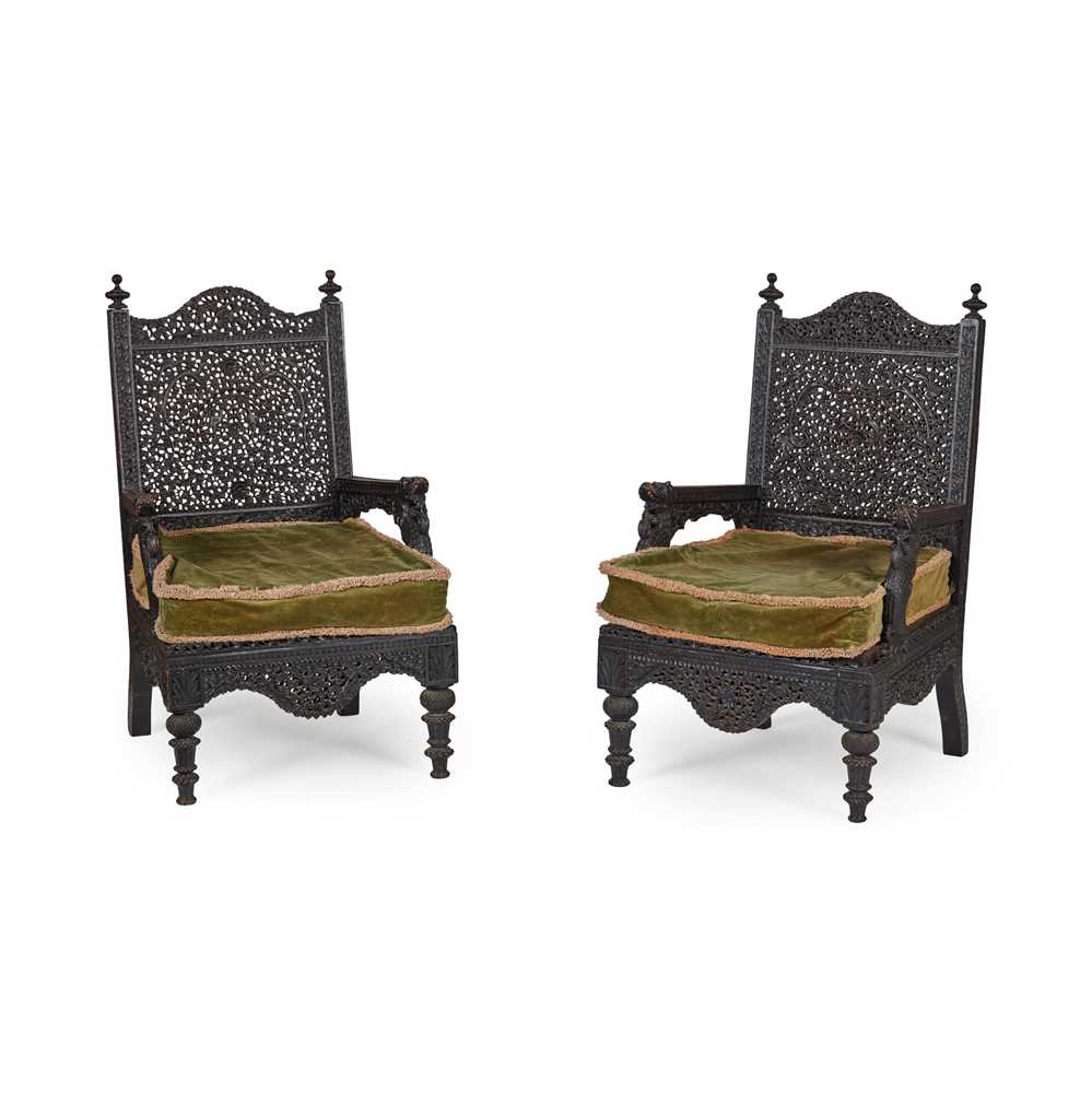 Appraisal: PAIR OF ANGLO BURMESE CARVED HARDWOOD ARMCHAIRS LATE TH CENTURY