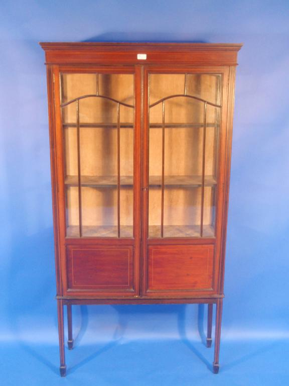 Appraisal: An Edwardian string inlaid mahogany display cabinet with two astragal