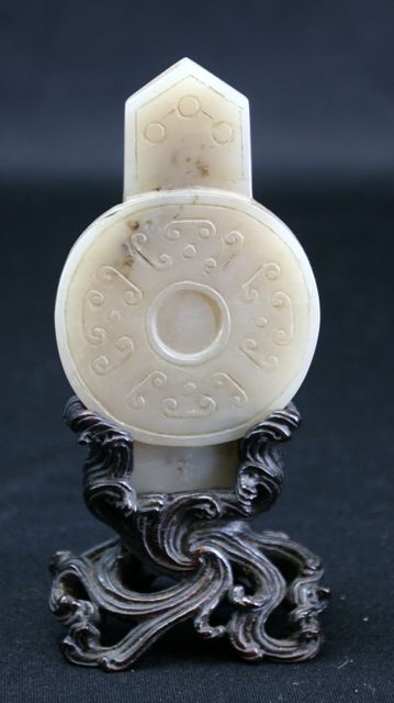 Appraisal: A carved mutton fat jade panel in arrow head and