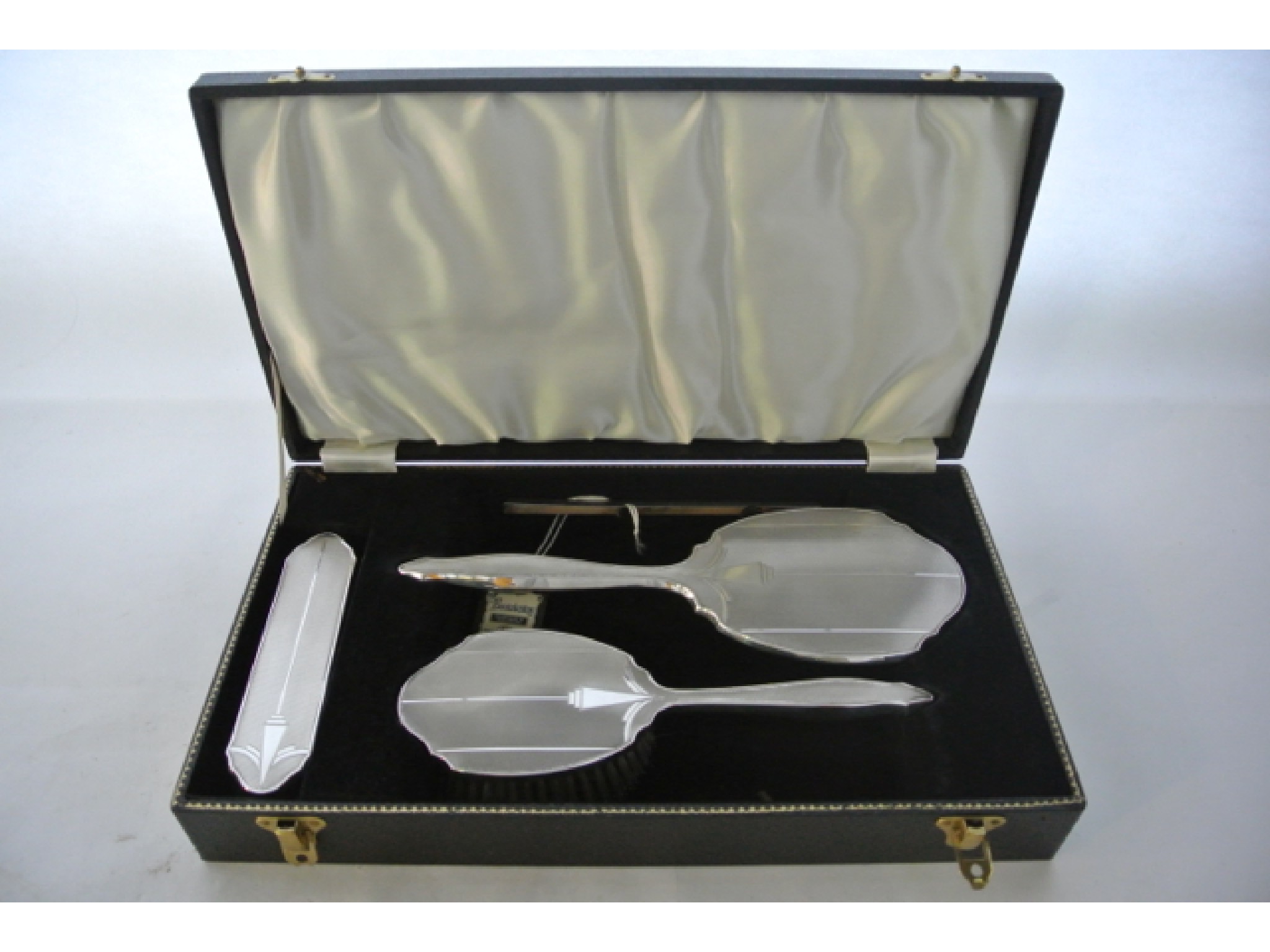 Appraisal: A cased silver-mounted dressing set W I Broadway Co Birmingham