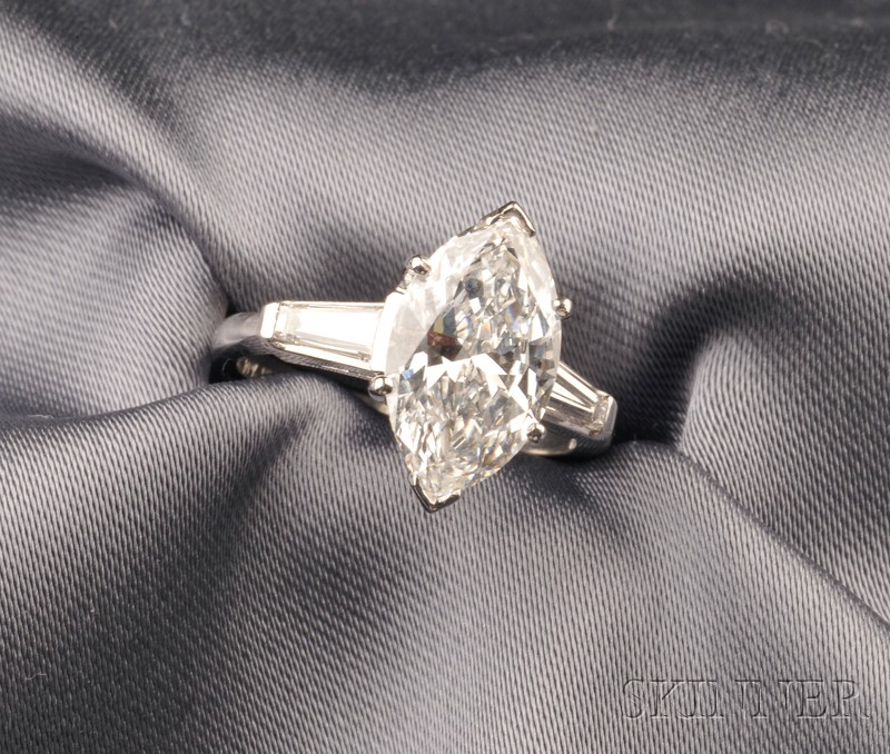 Appraisal: Platinum and Diamond Solitaire prong-set with a marquise-cut diamond weighing