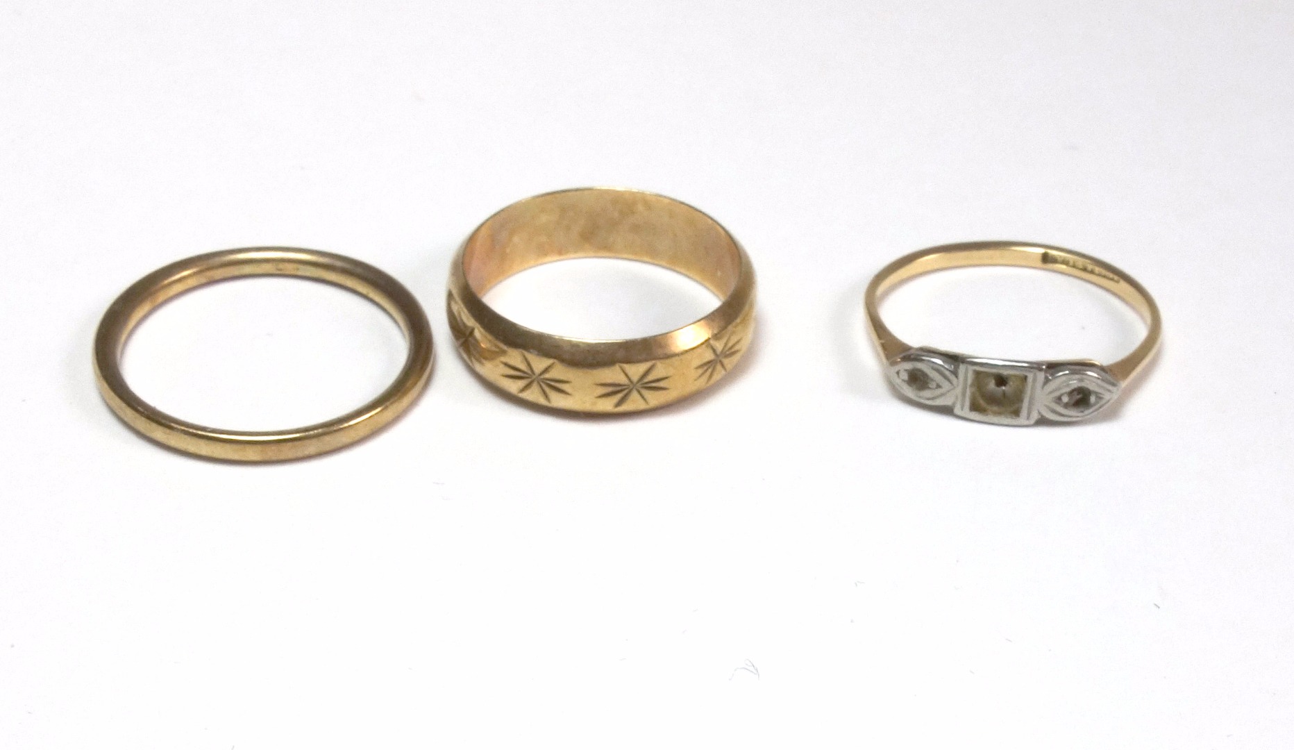 Appraisal: Three gold rings comprising an early th century three stone