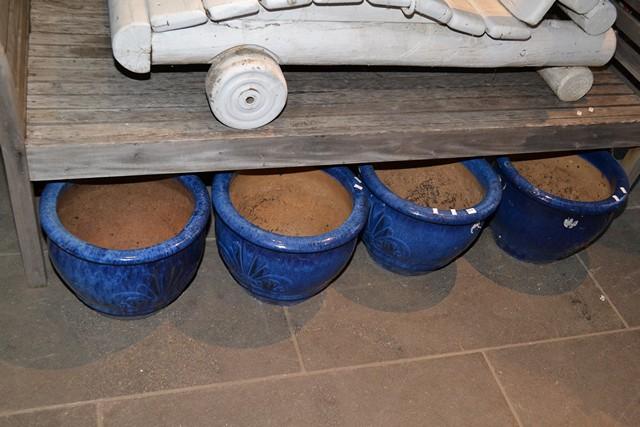 Appraisal: A SET OF FOUR GLAZED BLUE POTS