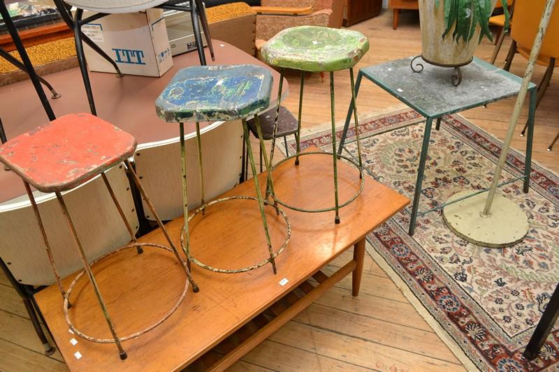 Appraisal: AN INDUSTRIAL GROUP OF FOUR RUSTIC PAINTED STOOLS AND TABLE