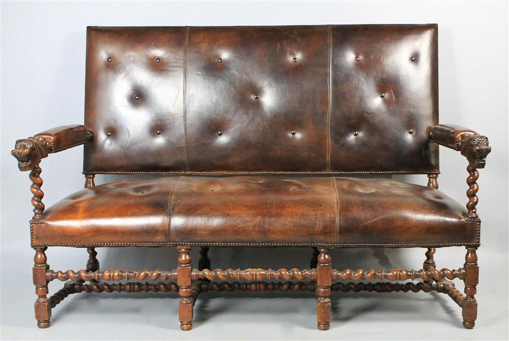 Appraisal: RENAISSANCE REVIVAL NAILHEAD ANTIQUED CHOCOLATE LEATHER SETTEE WITH LION HEAD