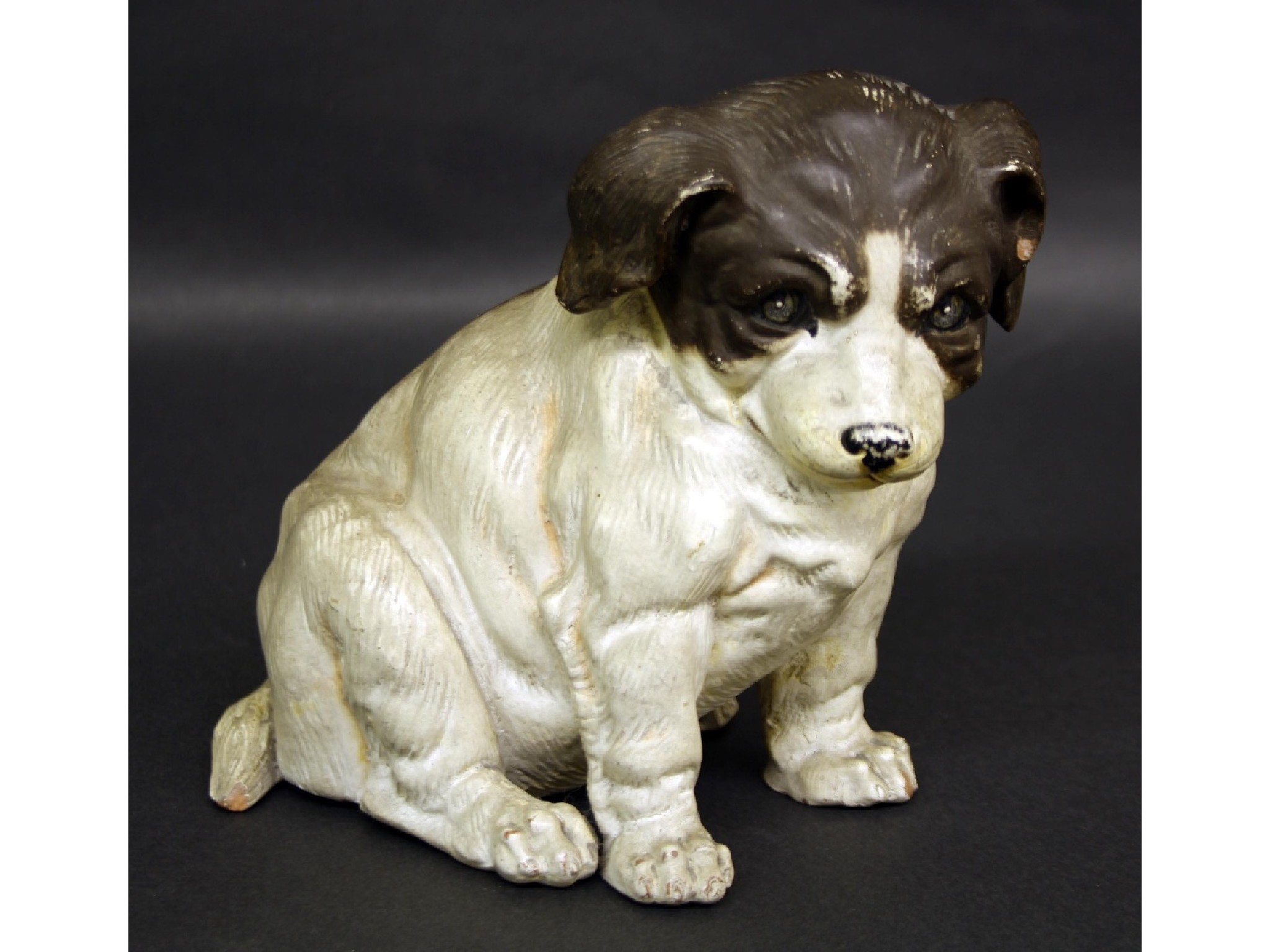 Appraisal: Continental terracotta figure of a seated hound high