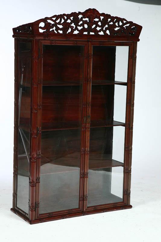 Appraisal: DISPLAY CABINET China th century Carved faux bamboo woodwork with