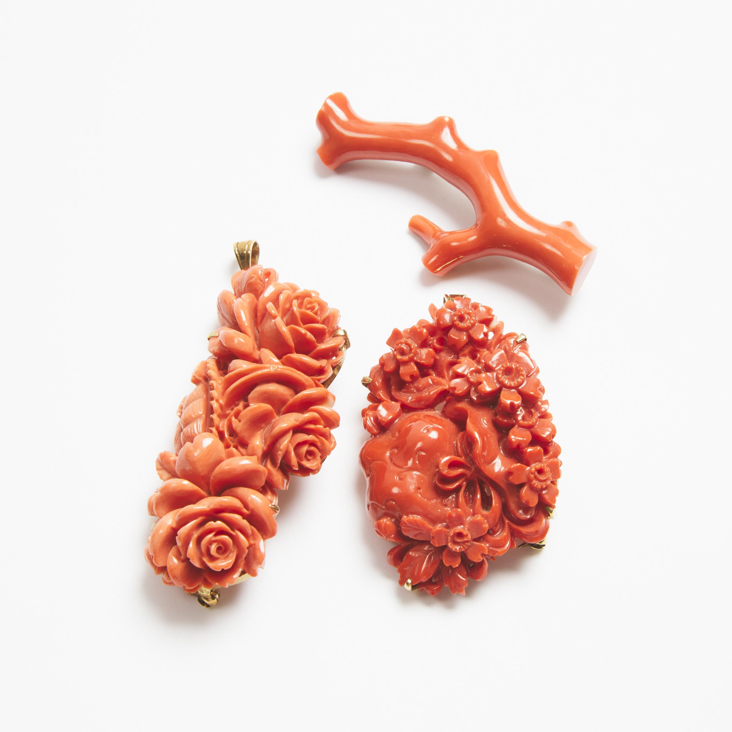 Appraisal: Three Carved Coral Brooches th Century largest length in cm