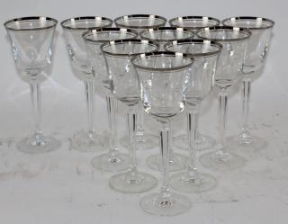 Appraisal: Set of crystal wine glasses with silver rim Set of