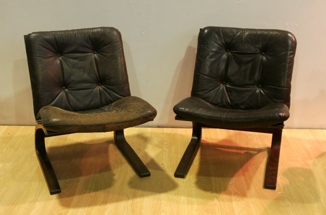 Appraisal: A pair of mid th century laminated leather lounge chairs