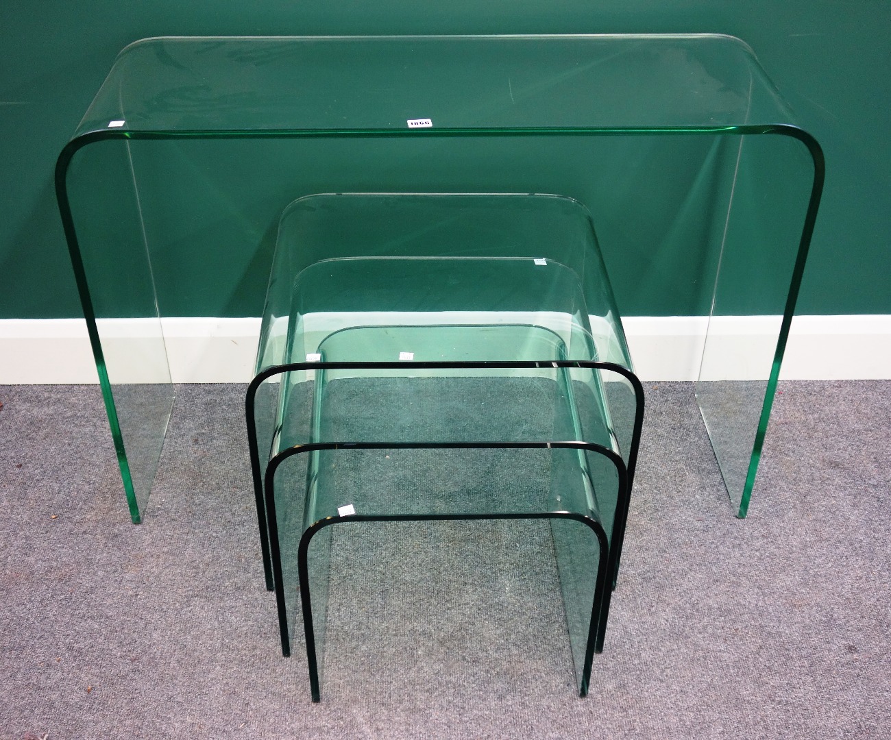 Appraisal: A nest of three th century moulded glass occasional tables