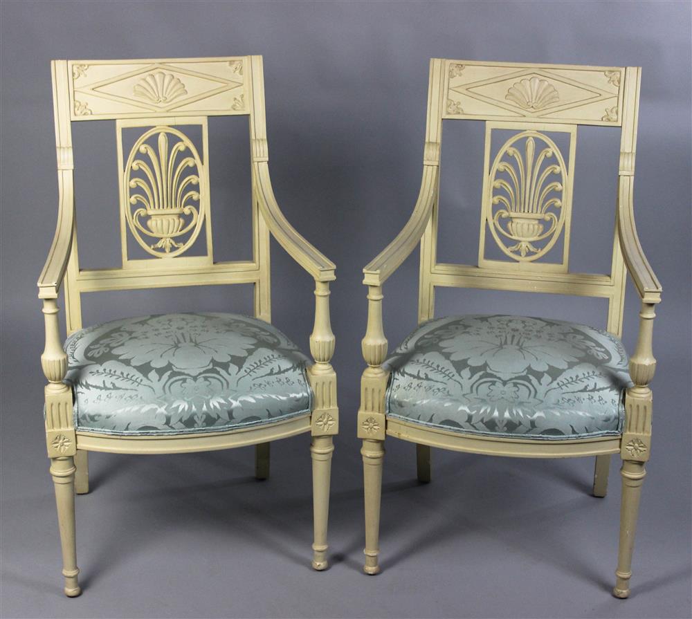 Appraisal: PAIR OF AVANTI DIRECTOIRE IVORY PAINTED ARM CHAIRS carved back